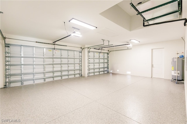 garage with water heater and a garage door opener