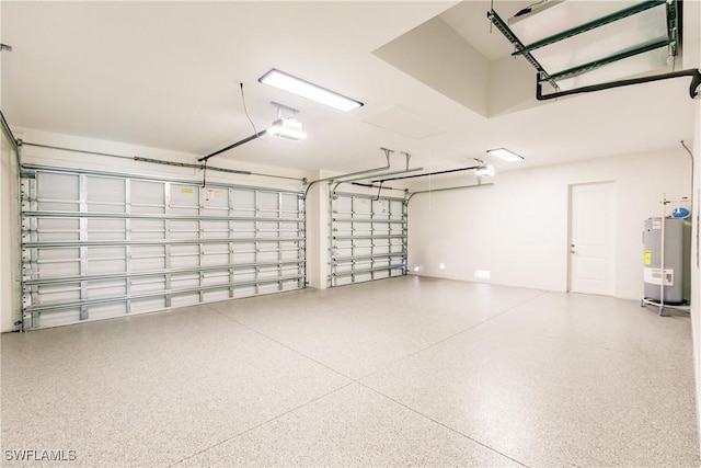 garage with a garage door opener and water heater