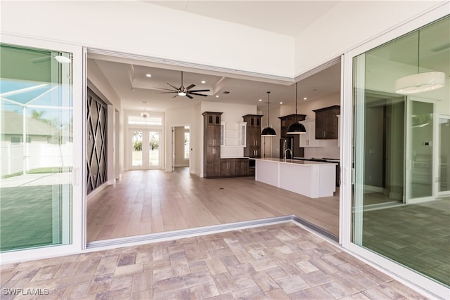 interior space featuring french doors, sink, ceiling fan, and light hardwood / wood-style floors