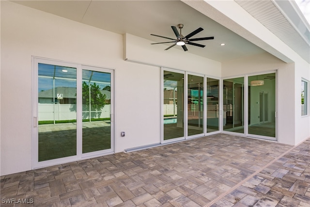 view of patio featuring ceiling fan