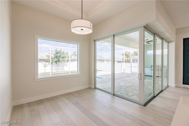 interior space with ceiling fan, french doors, and light hardwood / wood-style floors