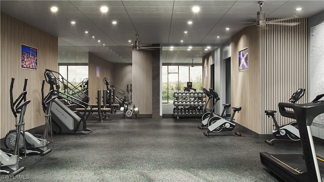 gym featuring a drop ceiling and ceiling fan