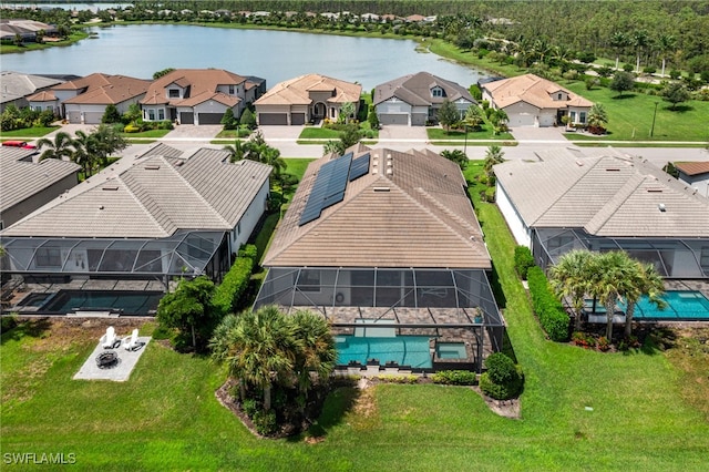 drone / aerial view with a water view