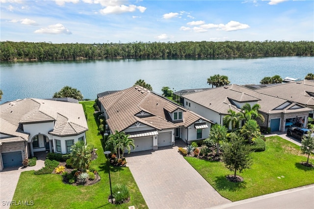 birds eye view of property with a water view