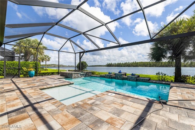 view of pool featuring glass enclosure, an in ground hot tub, a water view, and a patio