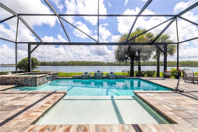 view of pool with a water view, pool water feature, an in ground hot tub, a patio, and glass enclosure