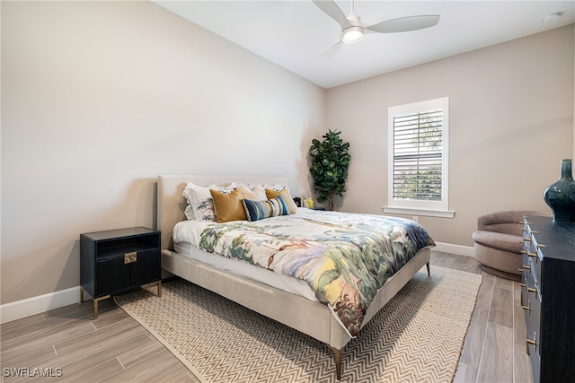 bedroom featuring ceiling fan and light hardwood / wood-style flooring