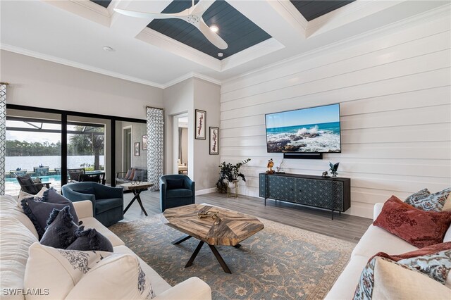 living room with crown molding, ceiling fan, coffered ceiling, and hardwood / wood-style flooring