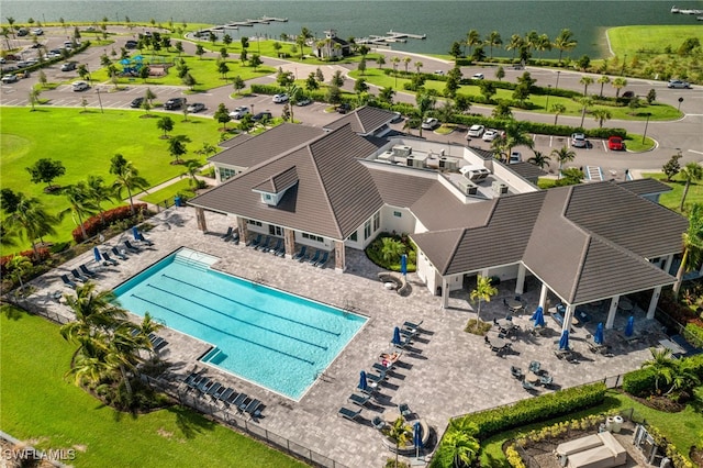 birds eye view of property with a water view