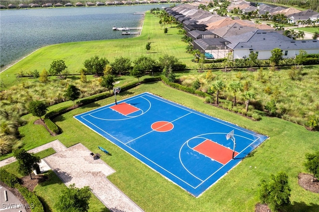 view of sport court featuring a water view