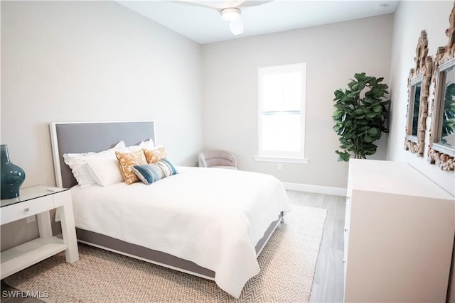 bedroom featuring ceiling fan and light hardwood / wood-style flooring