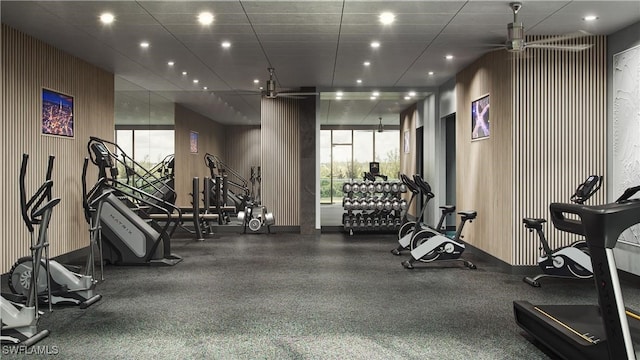 workout area with a drop ceiling and ceiling fan