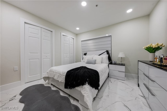 bedroom featuring multiple closets