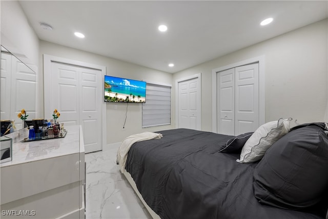 bedroom featuring multiple closets