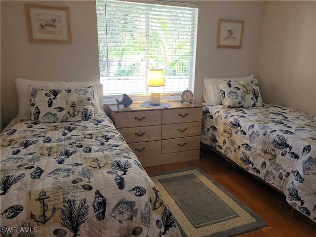 bedroom featuring dark wood-type flooring