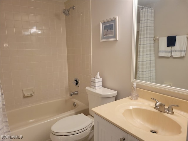 full bathroom with vanity, toilet, and shower / bath combo with shower curtain