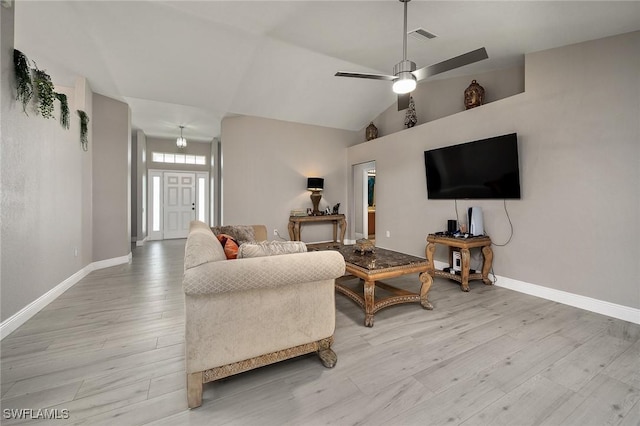 living room with ceiling fan and light wood-type flooring