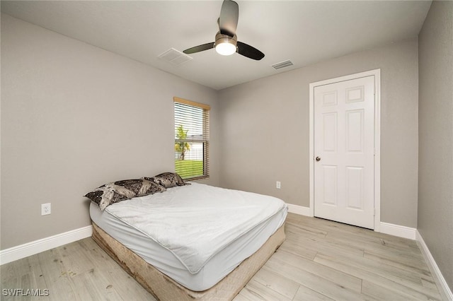 bedroom featuring ceiling fan and light hardwood / wood-style flooring