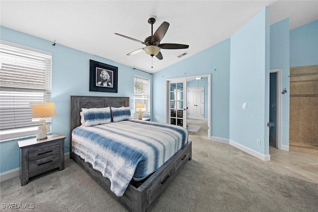 bedroom with vaulted ceiling, ceiling fan, and carpet