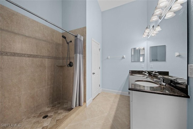 bathroom with tile patterned floors, a shower with shower curtain, and vanity