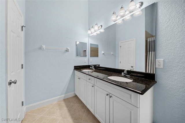 bathroom with vanity, tile patterned floors, and walk in shower