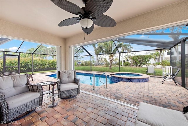 view of pool with an in ground hot tub, a patio, and glass enclosure