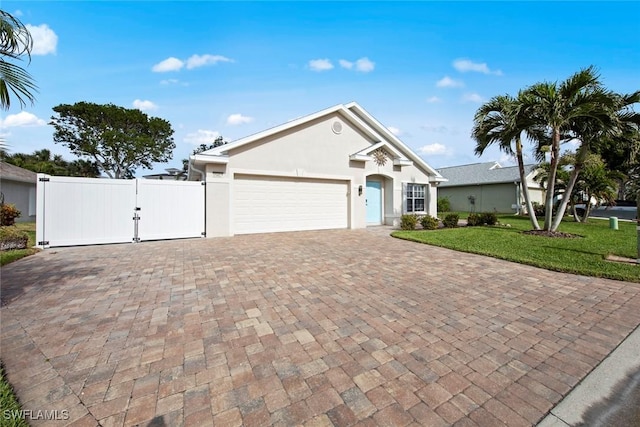 view of front of property featuring a garage and a front yard