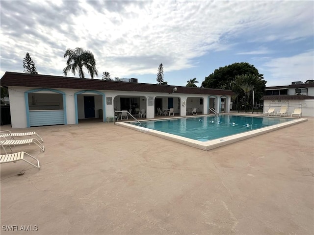 view of swimming pool featuring a patio area