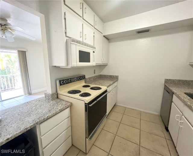 kitchen featuring ceiling fan, light tile patterned floors, white cabinets, and white appliances