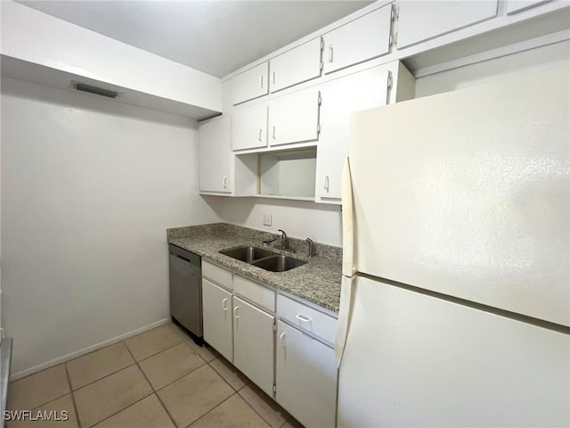 kitchen with stainless steel dishwasher, white refrigerator, white cabinetry, and sink