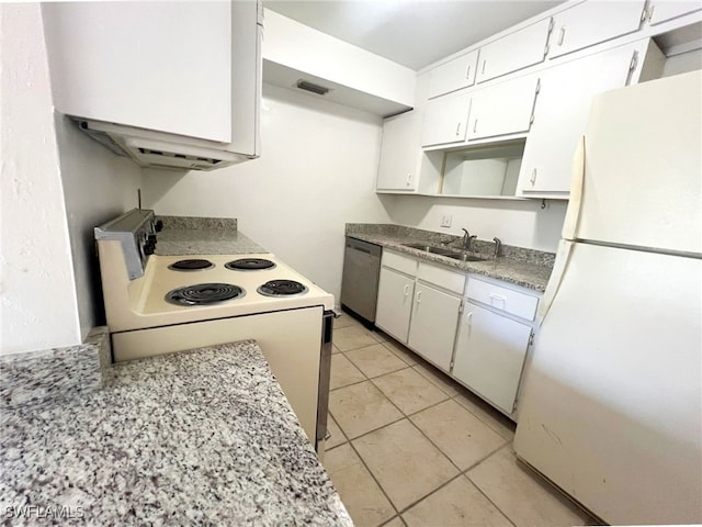 kitchen with sink, white cabinets, white appliances, and light tile patterned floors