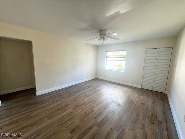 unfurnished bedroom with dark hardwood / wood-style floors and ceiling fan