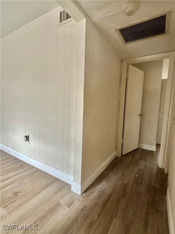 corridor featuring hardwood / wood-style flooring