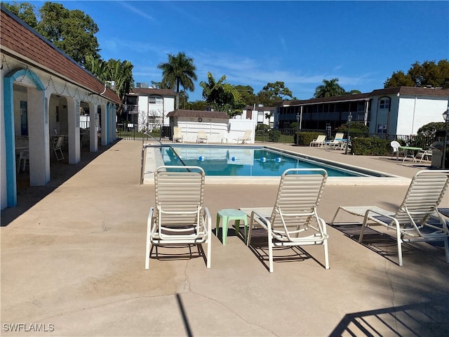 view of swimming pool with a patio area