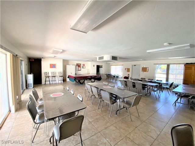 dining area with light tile patterned floors