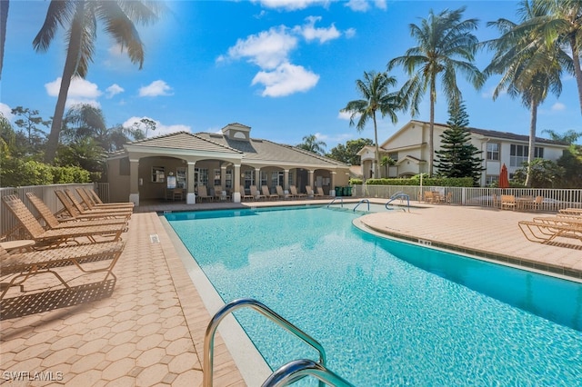 pool featuring a patio and fence