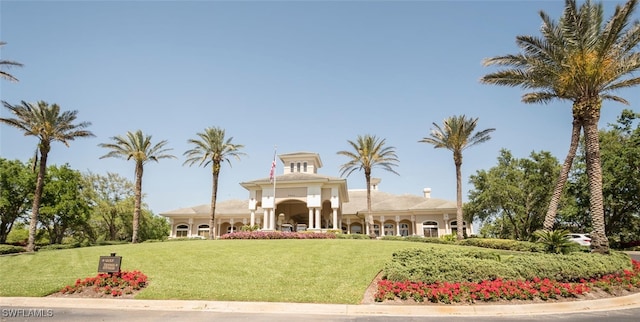 view of home's community featuring a lawn