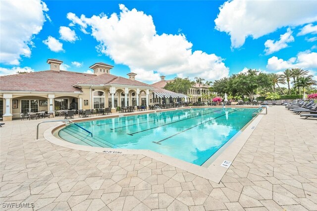 view of swimming pool featuring a patio