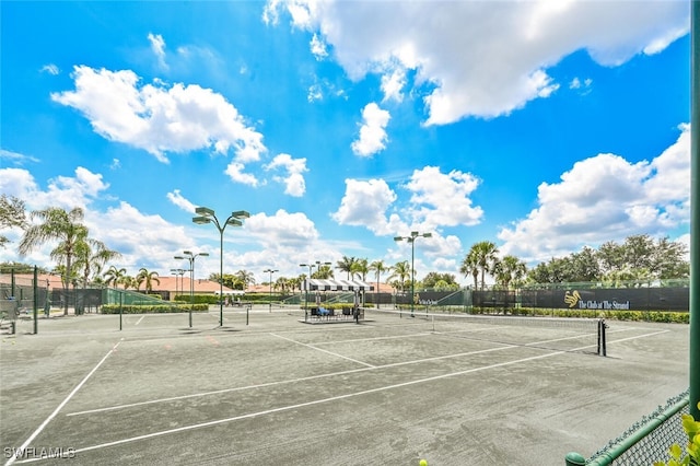 view of tennis court with fence