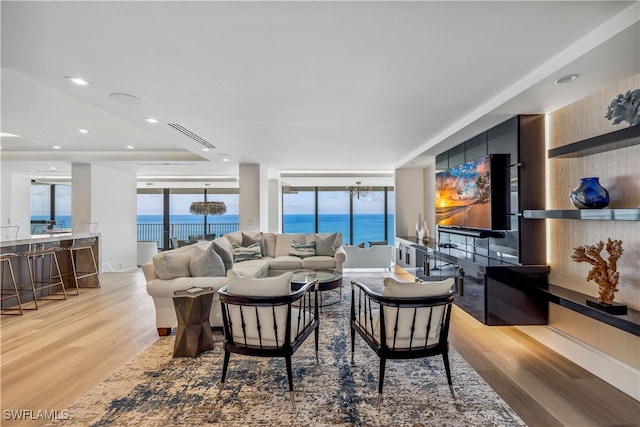 living room with light hardwood / wood-style flooring