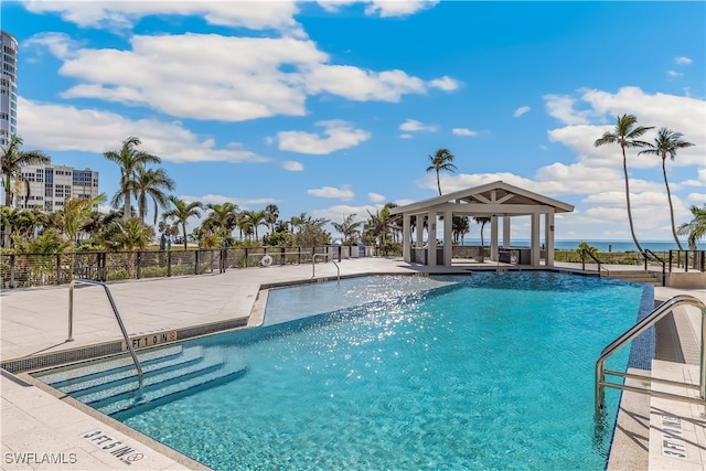 view of swimming pool with a patio