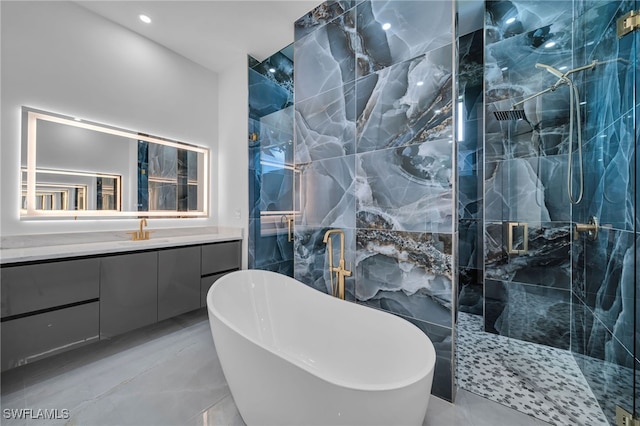 bathroom featuring separate shower and tub and vanity