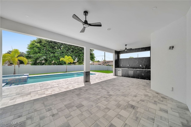 view of swimming pool with a patio area and ceiling fan