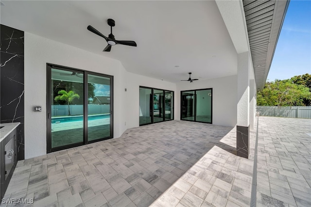 view of patio featuring ceiling fan