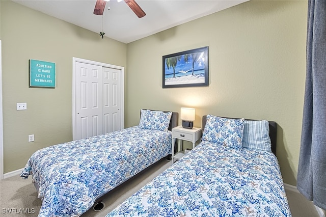 bedroom with ceiling fan, a closet, and carpet