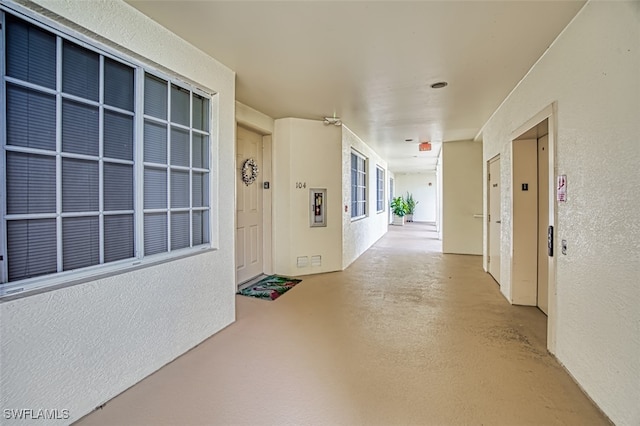 interior space with concrete floors and elevator