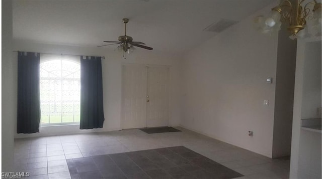 spare room featuring ceiling fan and light tile patterned floors