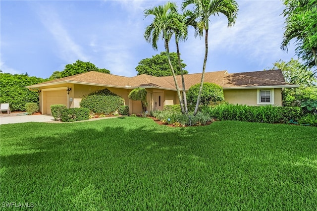 ranch-style home featuring a garage and a front lawn