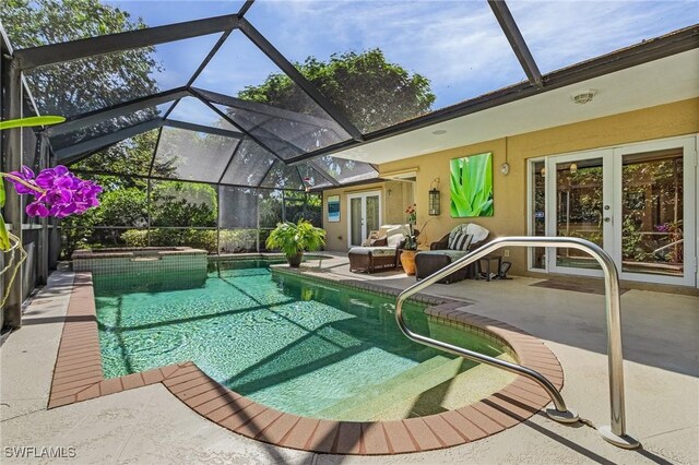 view of pool featuring a lanai and a patio