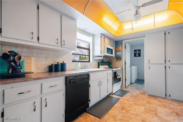 kitchen featuring white appliances, white cabinetry, ceiling fan, and sink